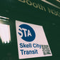 Skell City Station sticker attached to window of MTA transit worker booth.