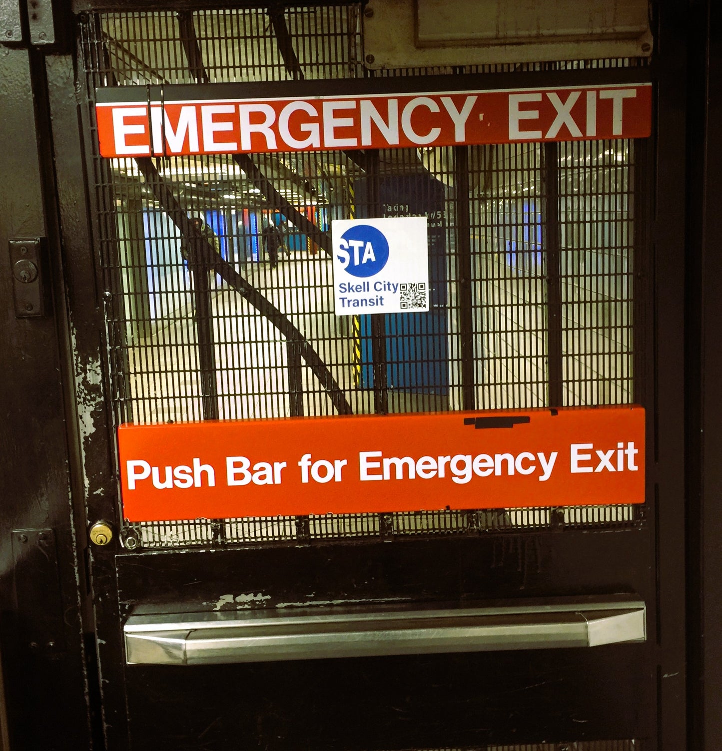 MTA station sticker from skell city, attached to emergency exit door.