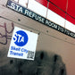 MTA Skell city sticker on station refuse room door, with graffiti.