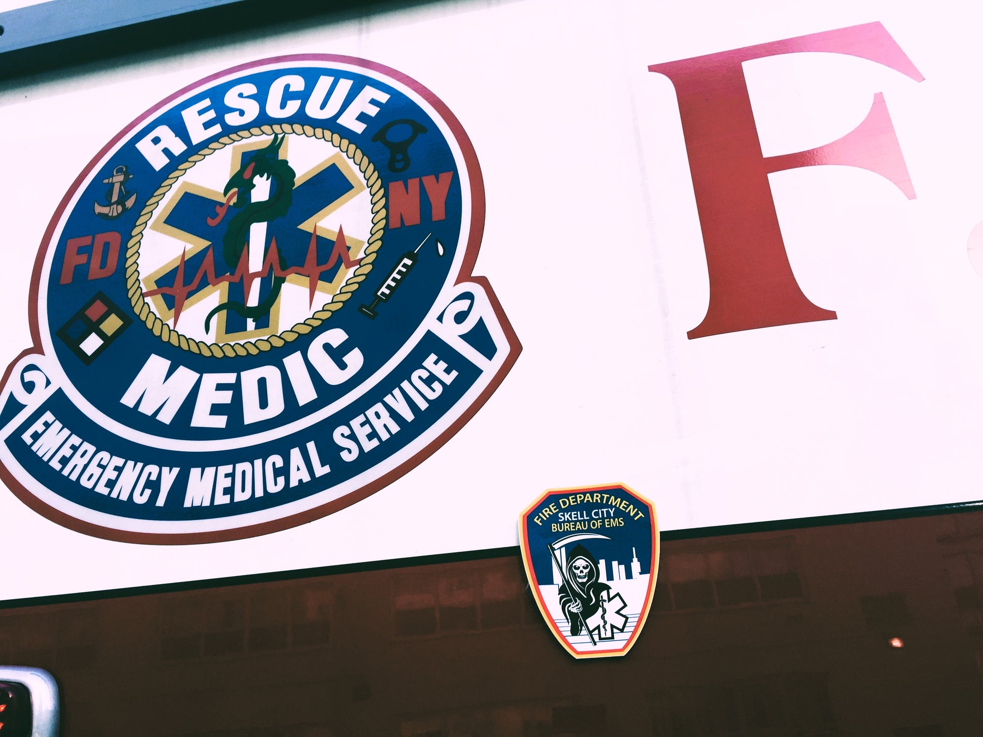 Skell City Fire Department Bureau of ems high gloss sticker on the side of FDNY Rescue medic ambulance underneath rescue medic logo.