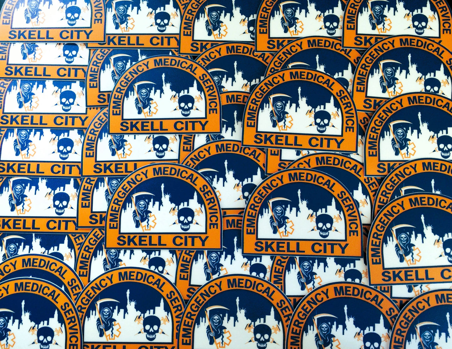 a sea of old nyc ems patch stickers from skell city.