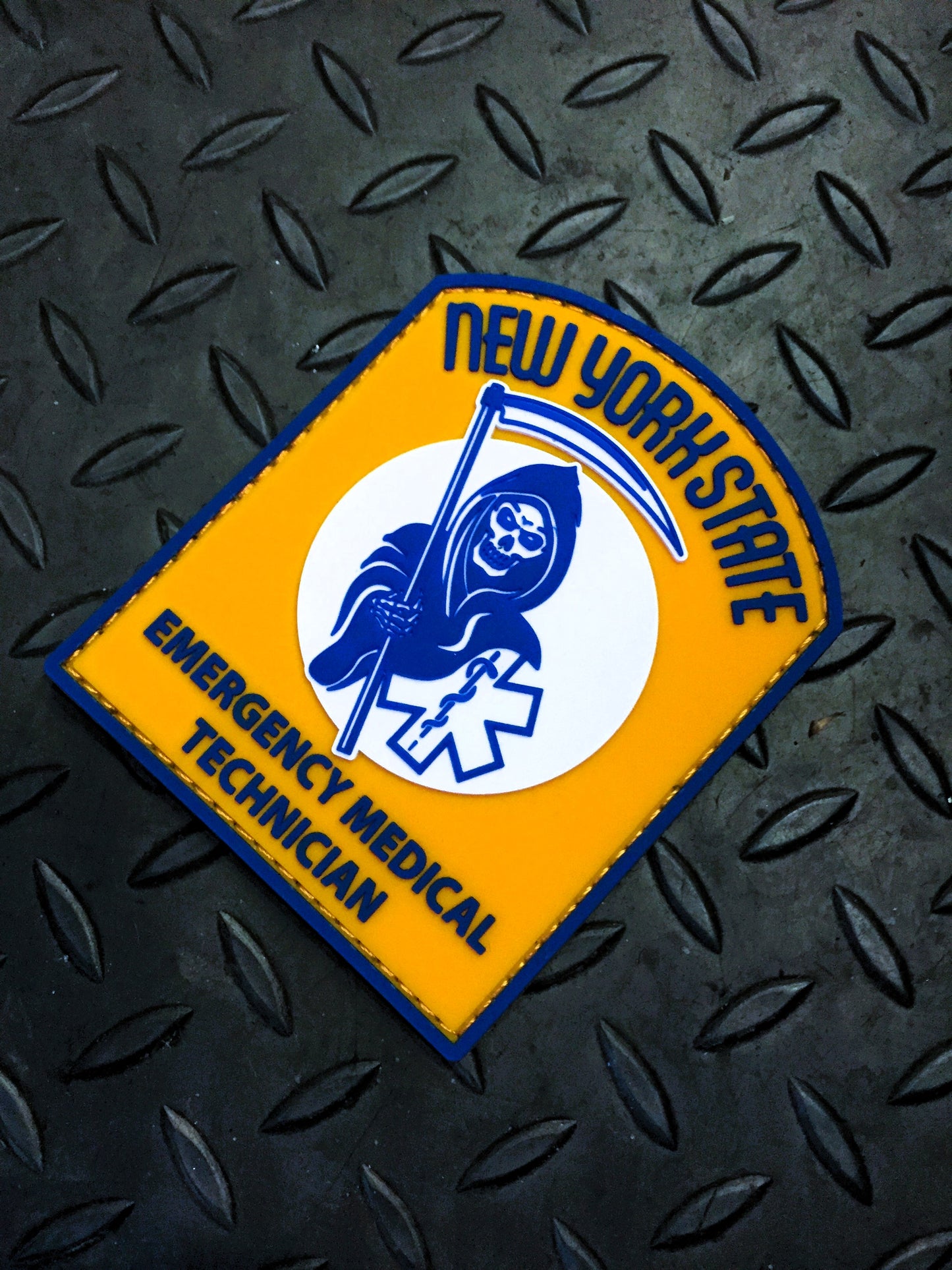 new york state skell city reaper EMT Velcro PVC patch against black steel background