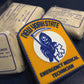 NYS EMT PVC Velcro patch leaning up against sling and swath cravats.