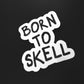 Skell city's Born to Skell clear sticker from skellcity.com against a solid black background.