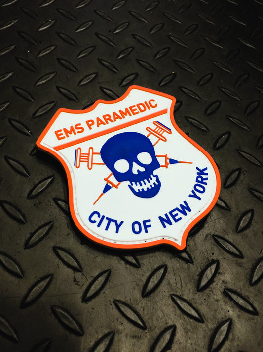 NYC EMS Paramedic Velcro PVC patch on a gray grid iron background.