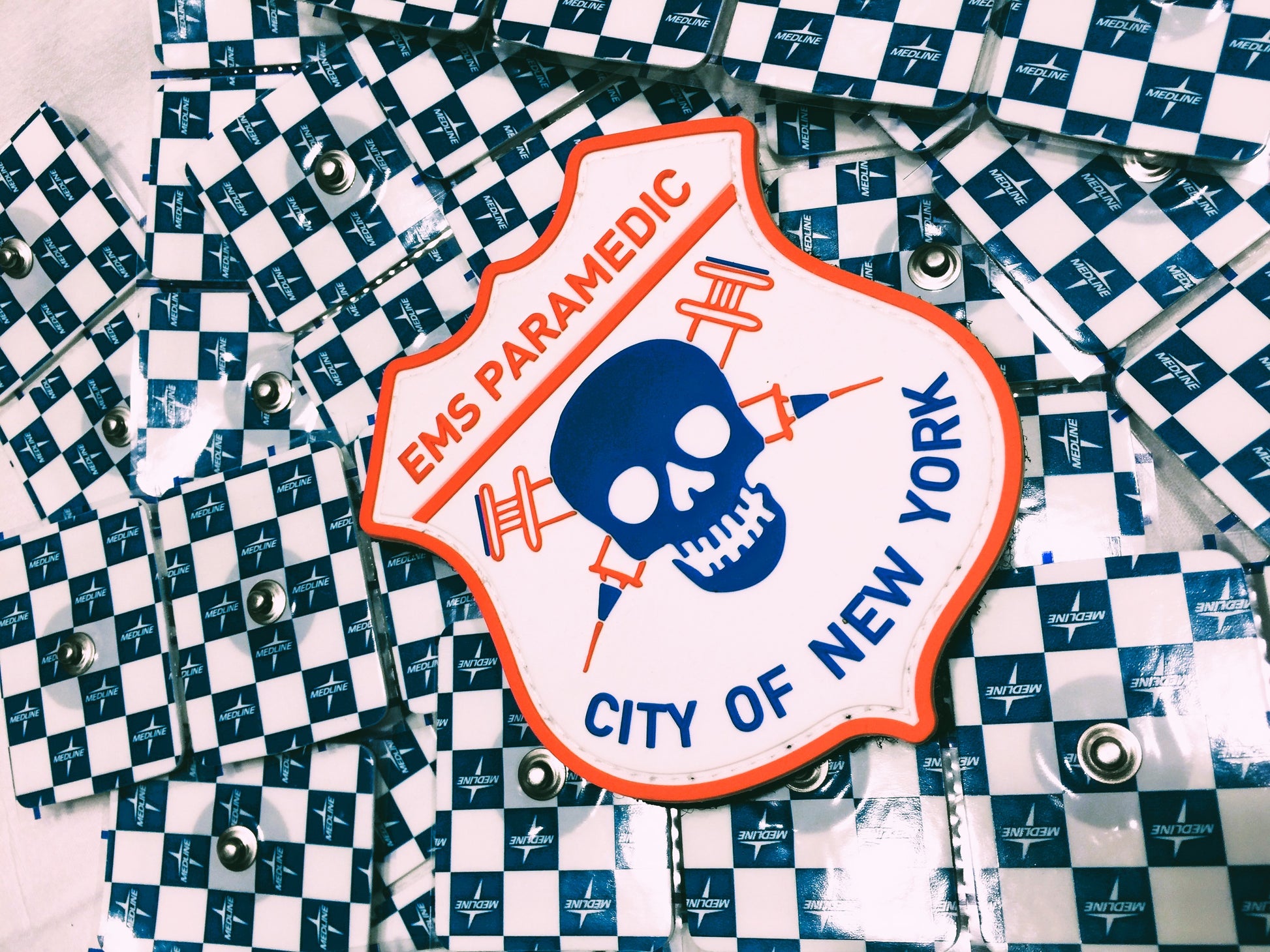 NYC ems paramedic patch on top of a bed of Medline EKG electrodes.