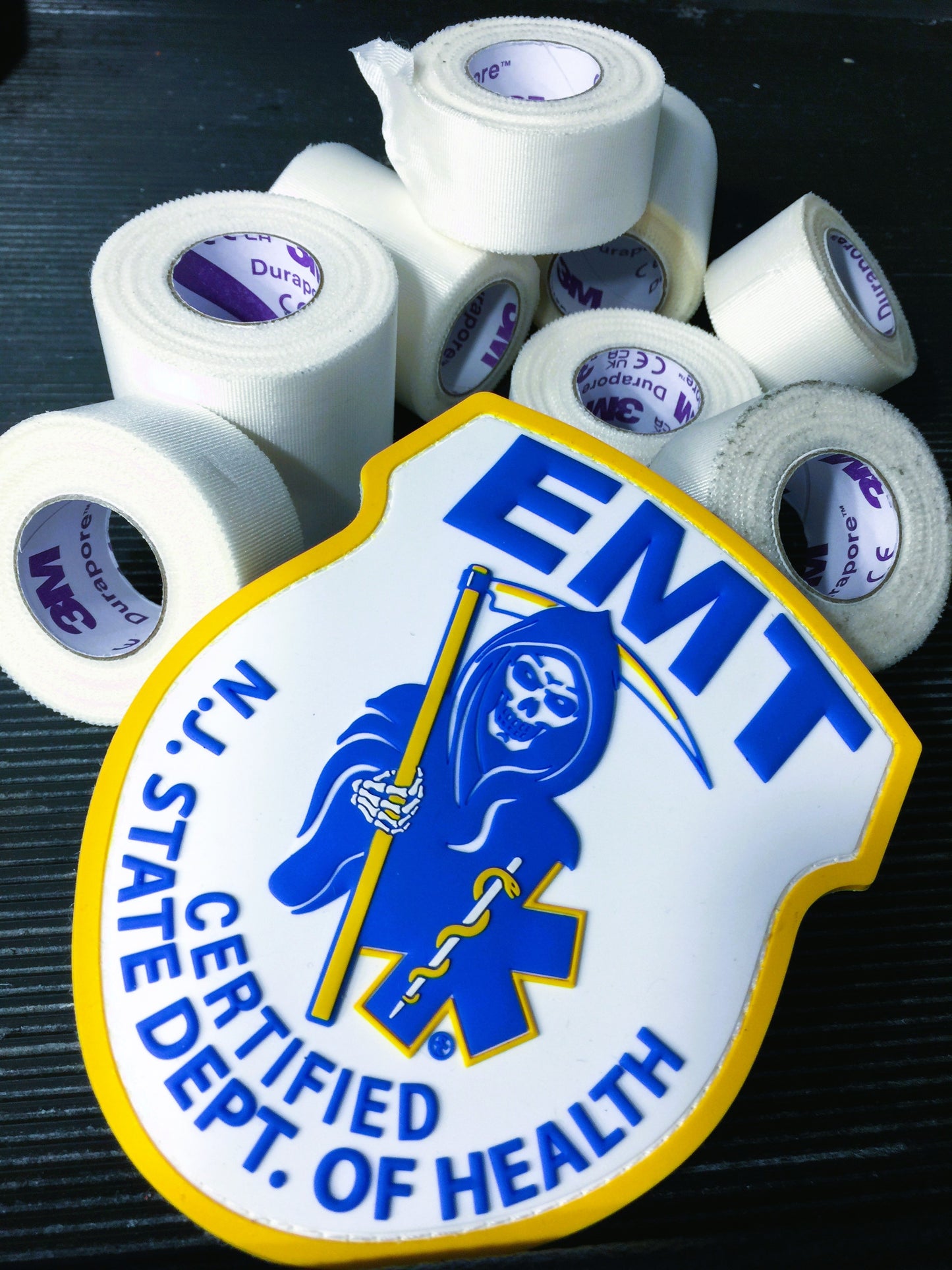 New Jersey EMT Patch, from skell city, up against 3M medical tape rolls.