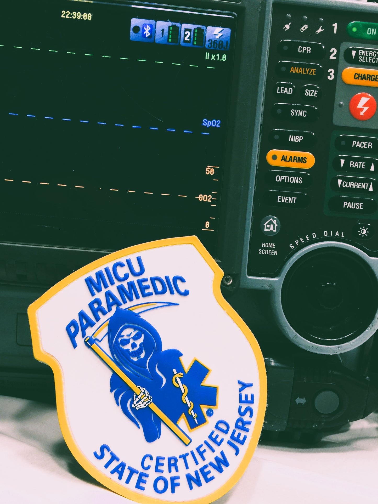 Skell City New Jersey MICU Paramedic PVC Velcro Patch up against physio control lifepak15 monitor and screen with button panel