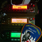 FDNY Firefighter patch from skell city next to Motorola radio transceivers.