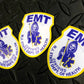 New Jersey EMT patch Reflective Helmet Stickers from skellcity.com against Black gridiron background.