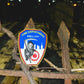 FDNY Firefighter patch on an old rusted iron fence, inside of graveyard.