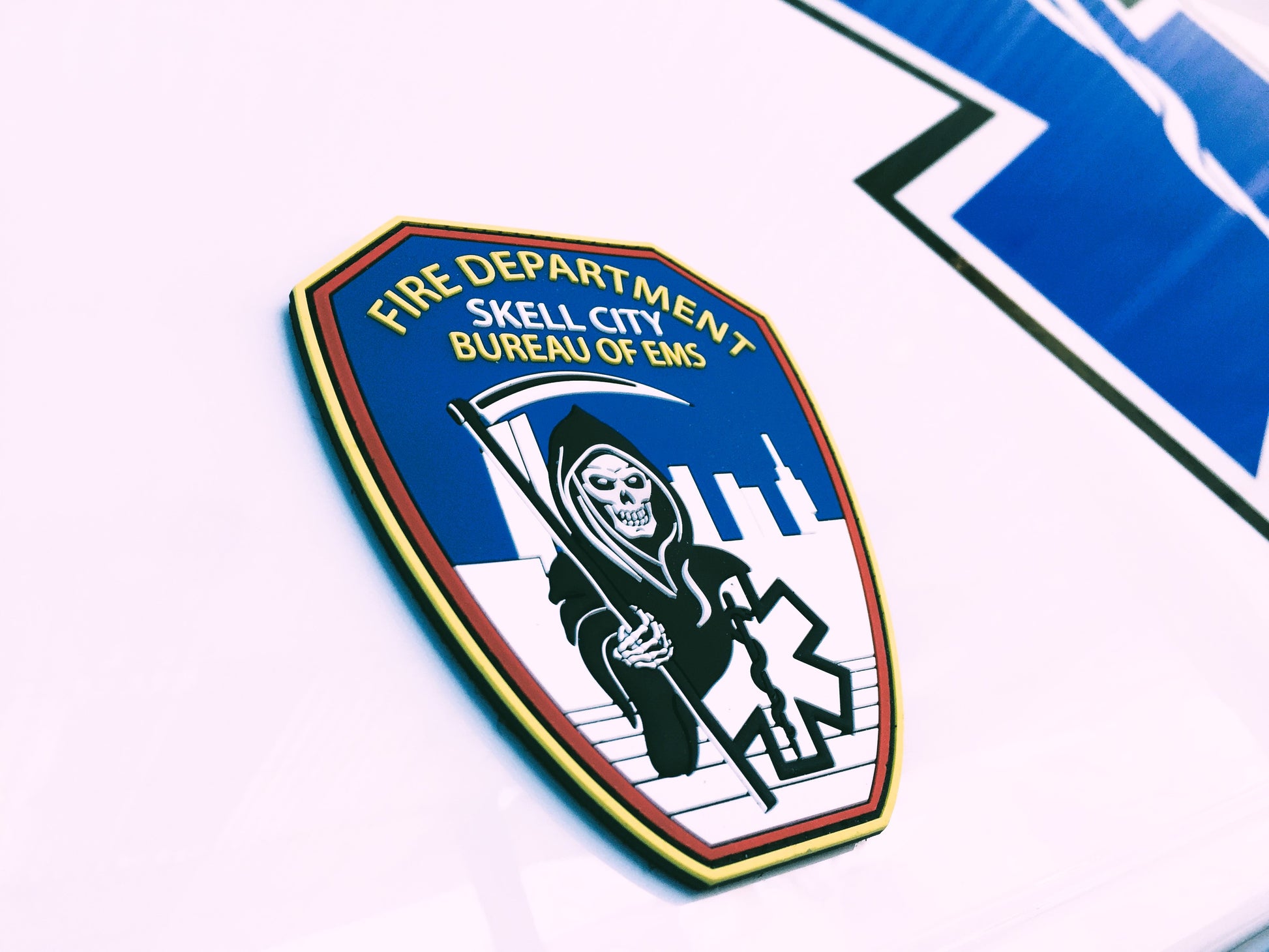 EMS Patch from skell city on the side of FDNY ambulance.